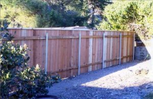 Butted Wood Fence with Cap and Round Posts