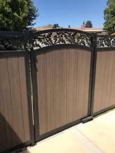 Metal picture frame gate with dark walnut vinyl inserts